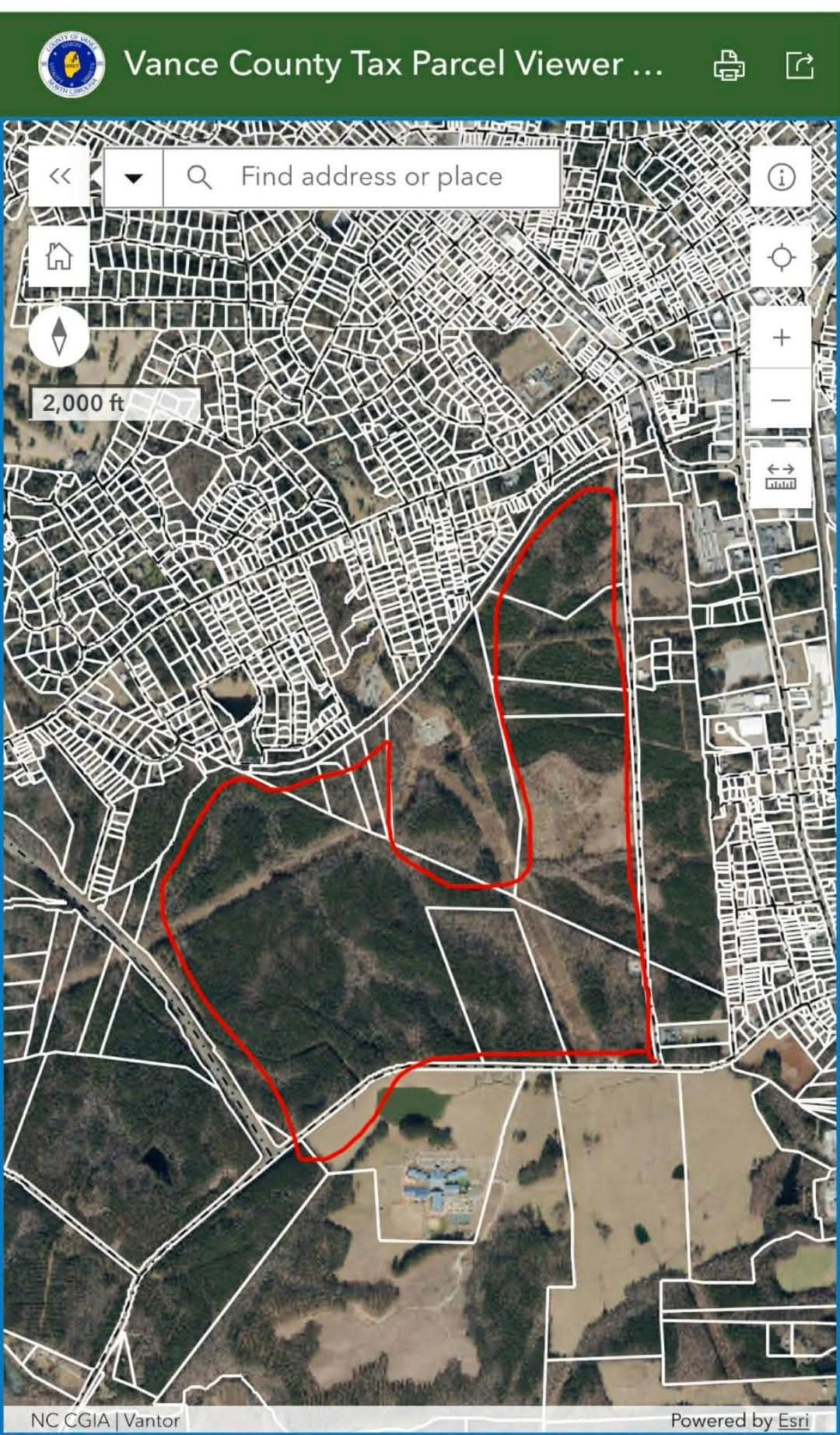 Vance County Tax Parcel Viewer showing the 700-acre ELS development parcels outlined in red, adjacent to Henderson residential neighborhoods